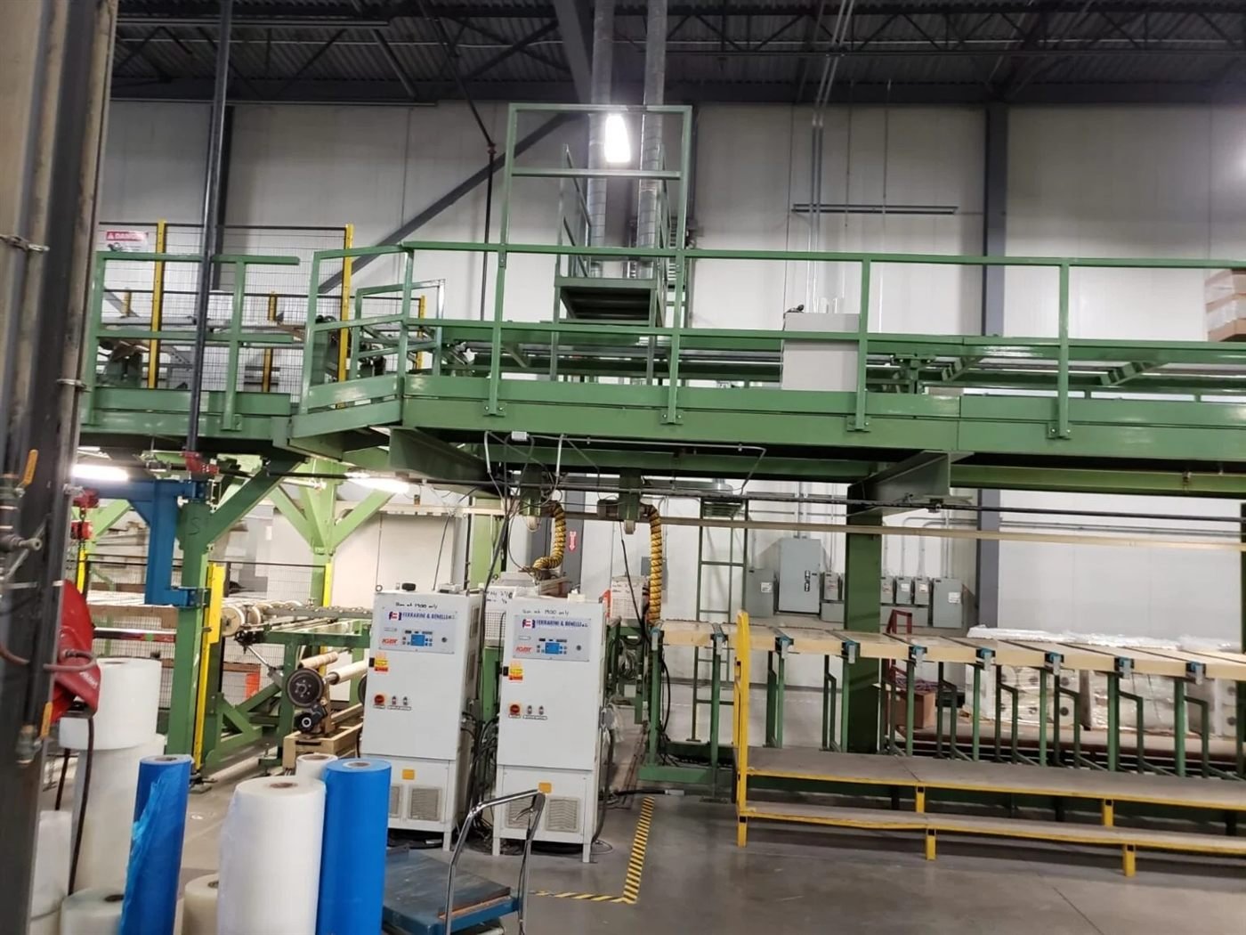 Continuous production line with cooling and wrapping station automated by XNC